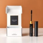 Glossy mascara box packaging in black and gold